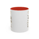 A white ceramic mug with a vibrant red interior, featuring vintage-style illustrated graphics printed on the sides.