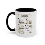A white ceramic mug with a black handle and black interior, featuring a printed graphic titled 'Entrepreneur Starter Pack' with illustrated steps and startup-themed doodles.