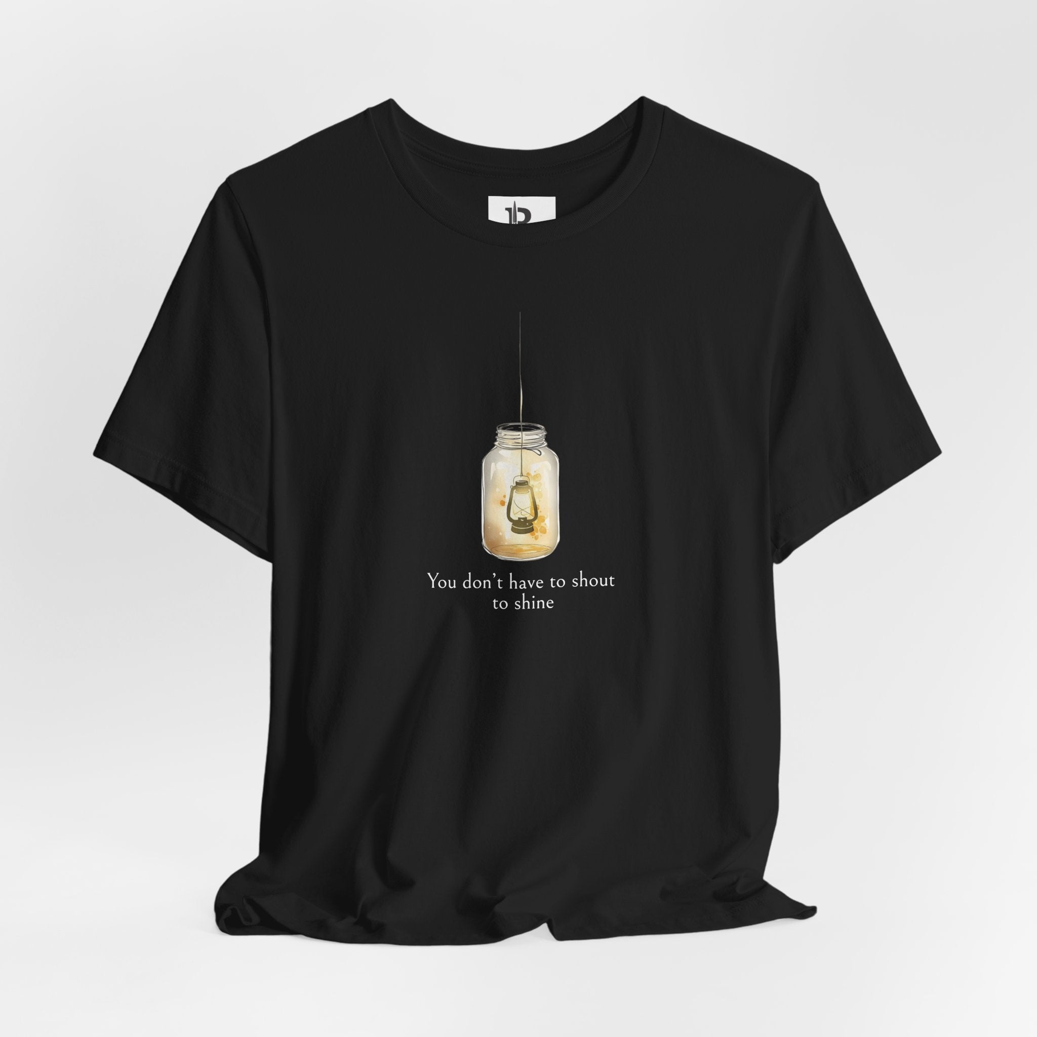 Minimalist Lantern T-Shirt – “You Don’t Have to Shout to Shine” Aesthetic Tee