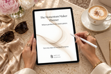 The Momentum Maker Planner on an iPad with Apple Pencil on a travertine table