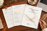 Printed Momentum Maker Planner pages fanned out on a walnut desk with leather desk pad