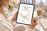 The Momentum Maker Planner on an iPad held by a woman at a marble desk in a luxury office
